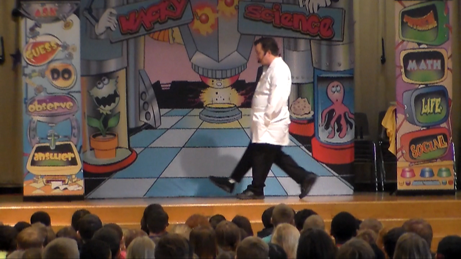 STEM science school assembly performer Cris Johnson with 3 legs